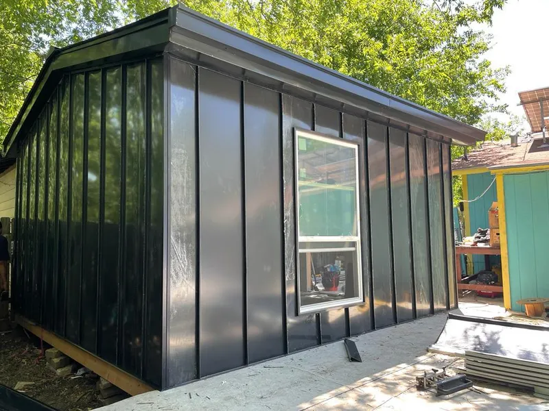 Black standing seam metal wall panels for Roof Inspection in Newfane